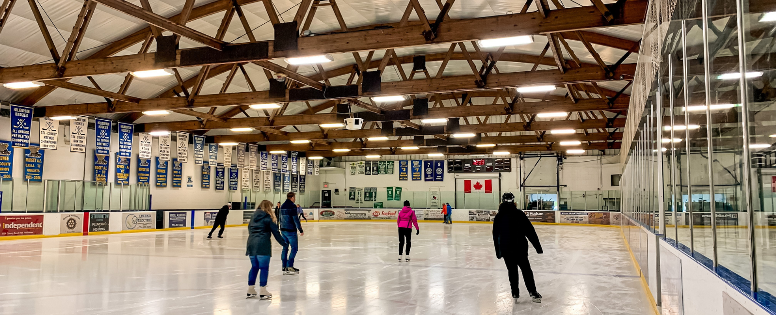 Individuals skating on the ice surface at the A.J. LaRue Arena